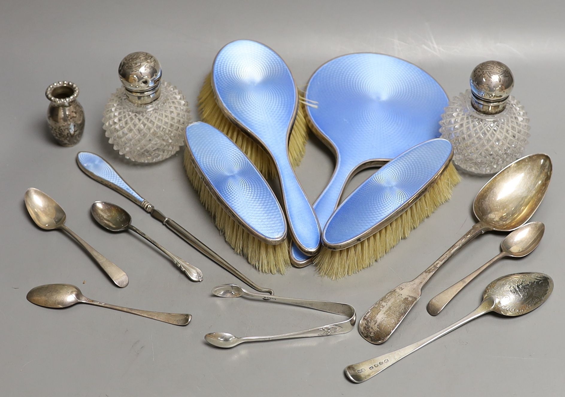 Two silver mounted glass scent bottles, a miniature Scottish silver vase, a five piece silver and guilloche enamelled dressing table set and a small group of assorted silver and sterling flatware